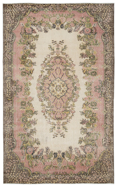 Load image 1 in gallery view. Cream, pink, and brown vintage-style rug with a central floral medallion and ornate botanical border.