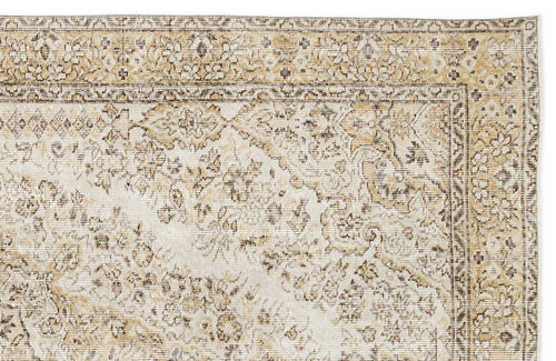 Load image 1 in gallery view. Beige and cream vintage-style rug with a distressed traditional floral medallion pattern and a detailed border.