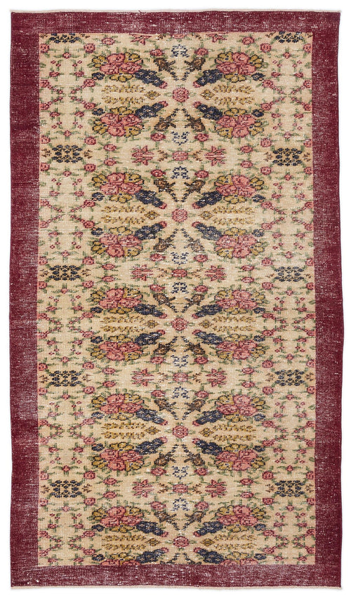 Load image 1 in gallery view. Beige vintage-style rug with a deep red border and a repeating floral medallion pattern in pink, blue, and yellow.