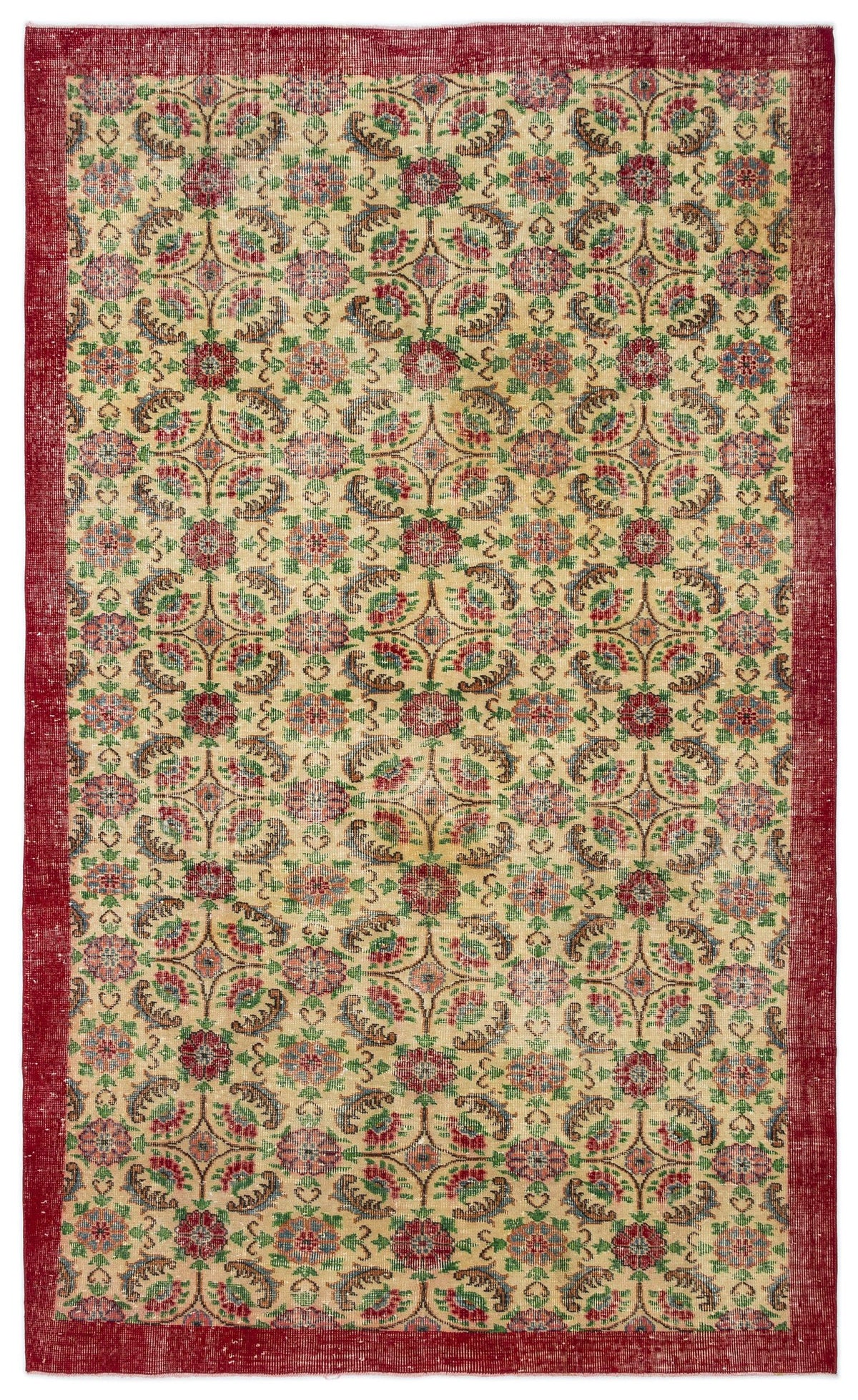 Beige rug with a red border and a repeating floral medallion pattern in red, green, and blue.