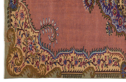 Load image 1 in gallery view. Dusty rose rug with a beige floral border, featuring intricate blue, green, and red traditional Persian-style motifs.