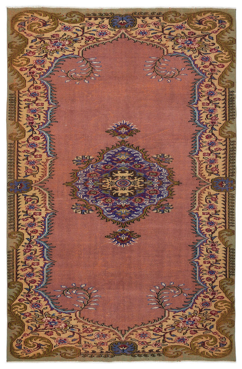 Load image 1 in gallery view. Dusty rose traditional rug with a central blue floral medallion and an ornate beige and olive green botanical border.