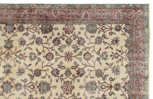 Load image 1 in gallery view. Beige traditional rug with a red, blue, and green floral vine pattern and a multi-layered decorative border.