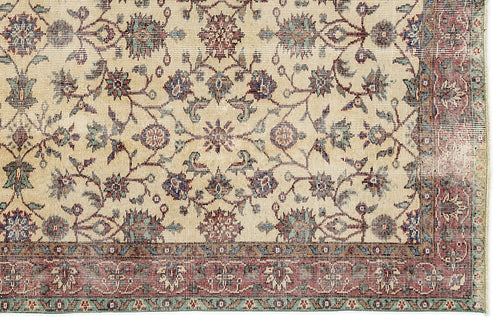 Load image 1 in gallery view. Beige traditional rug with a floral vine pattern in red, blue, and green, featuring a wide decorative border.