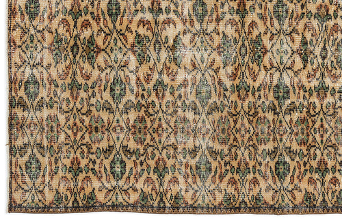 Load image 1 in gallery view. Tan, green, and rust-colored vintage-style rug with a repeating diamond lattice and floral medallion pattern.
