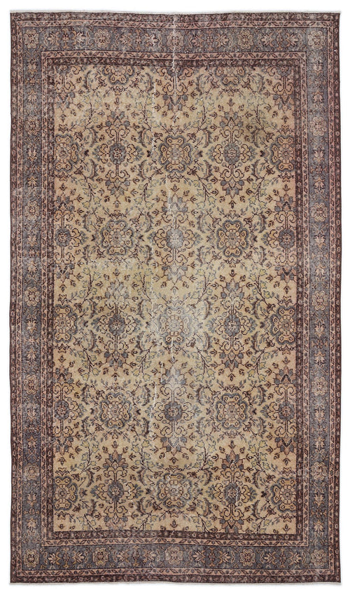 Load image 1 in gallery view. Distressed beige and charcoal traditional rug with a central floral medallion and ornate border.
