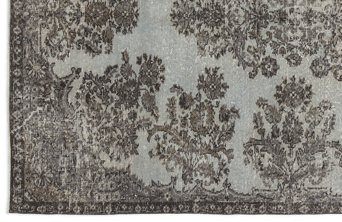 Load image 1 in gallery view. Light blue and charcoal grey rug with a distressed floral medallion pattern and a dark border.