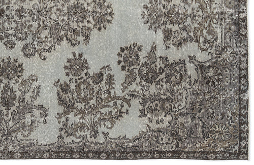 Load image 1 in gallery view. Light blue and charcoal grey rug with a distressed, traditional floral medallion pattern and a dark border.