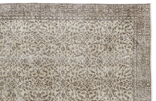 Load image 1 in gallery view. Taupe and cream vintage-style rug with a distressed floral medallion pattern and a wide decorative border.