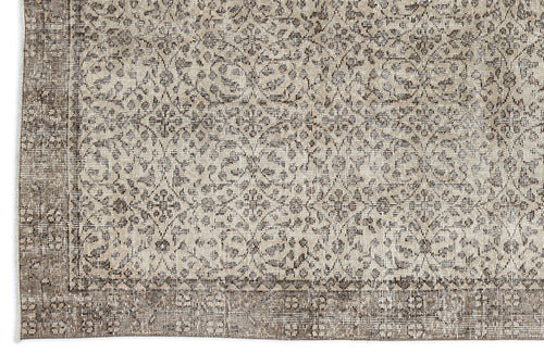 Load image 1 in gallery view. Beige and charcoal grey rug with a distressed traditional floral medallion pattern and a wide decorative border.