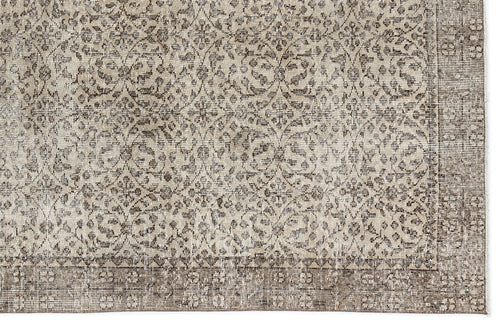 Load image 1 in gallery view. Taupe and cream rug with a distressed traditional floral medallion pattern and a wide geometric border.