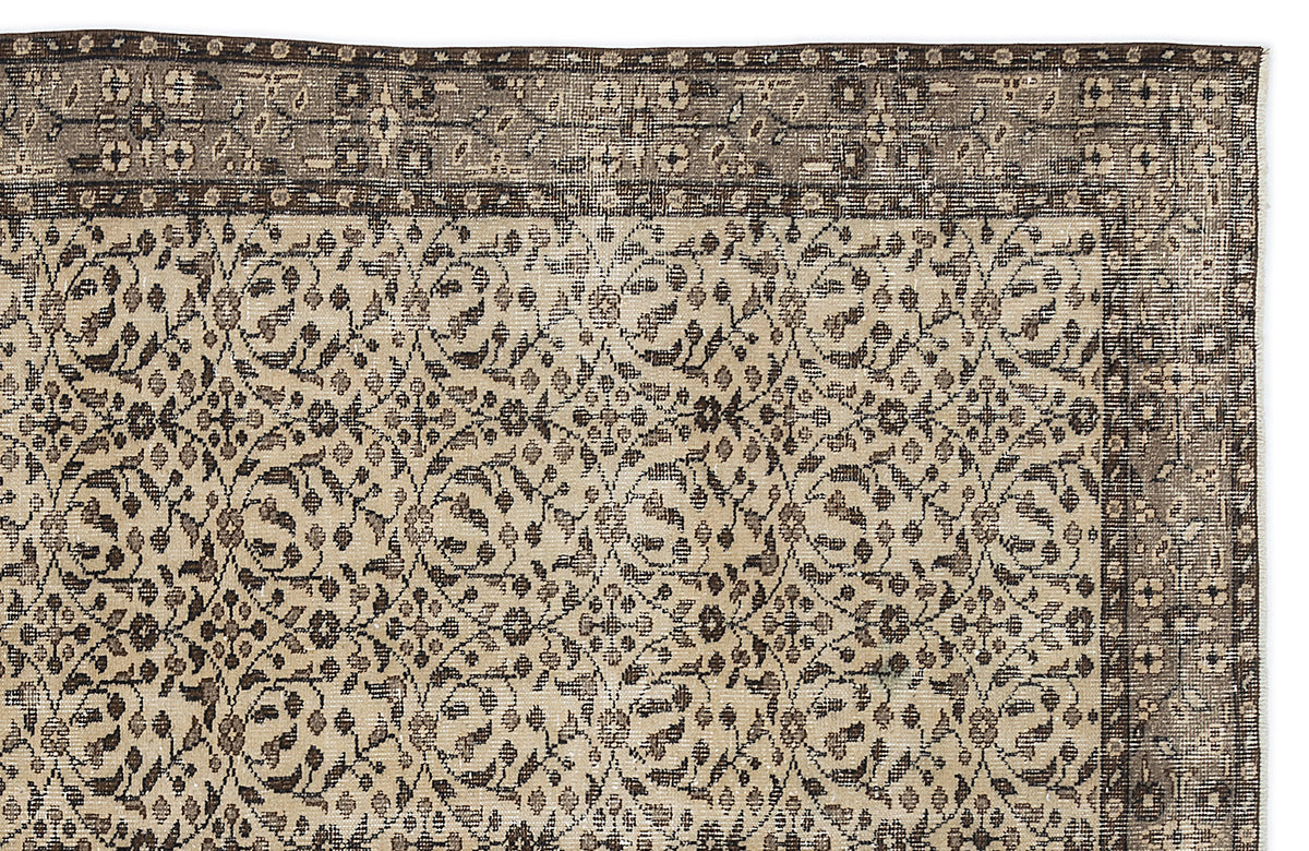 Beige and dark brown traditional rug with a repeating floral vine pattern and a wide, ornate border.