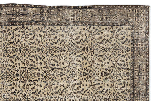 Load image 1 in gallery view. Beige and dark brown traditional rug with a repeating floral vine pattern and a wide, ornate border.