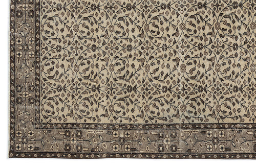 Load image 1 in gallery view. Beige and dark brown rug with a repeating floral vine pattern and a wide, detailed border.