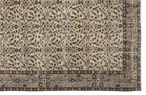 Load image 1 in gallery view. Beige and brown traditional rug with a dense floral vine pattern and a wide, ornate border.