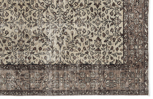Load image 1 in gallery view. Beige and dark brown distressed rug with a traditional floral pattern and a wide, ornate border.
