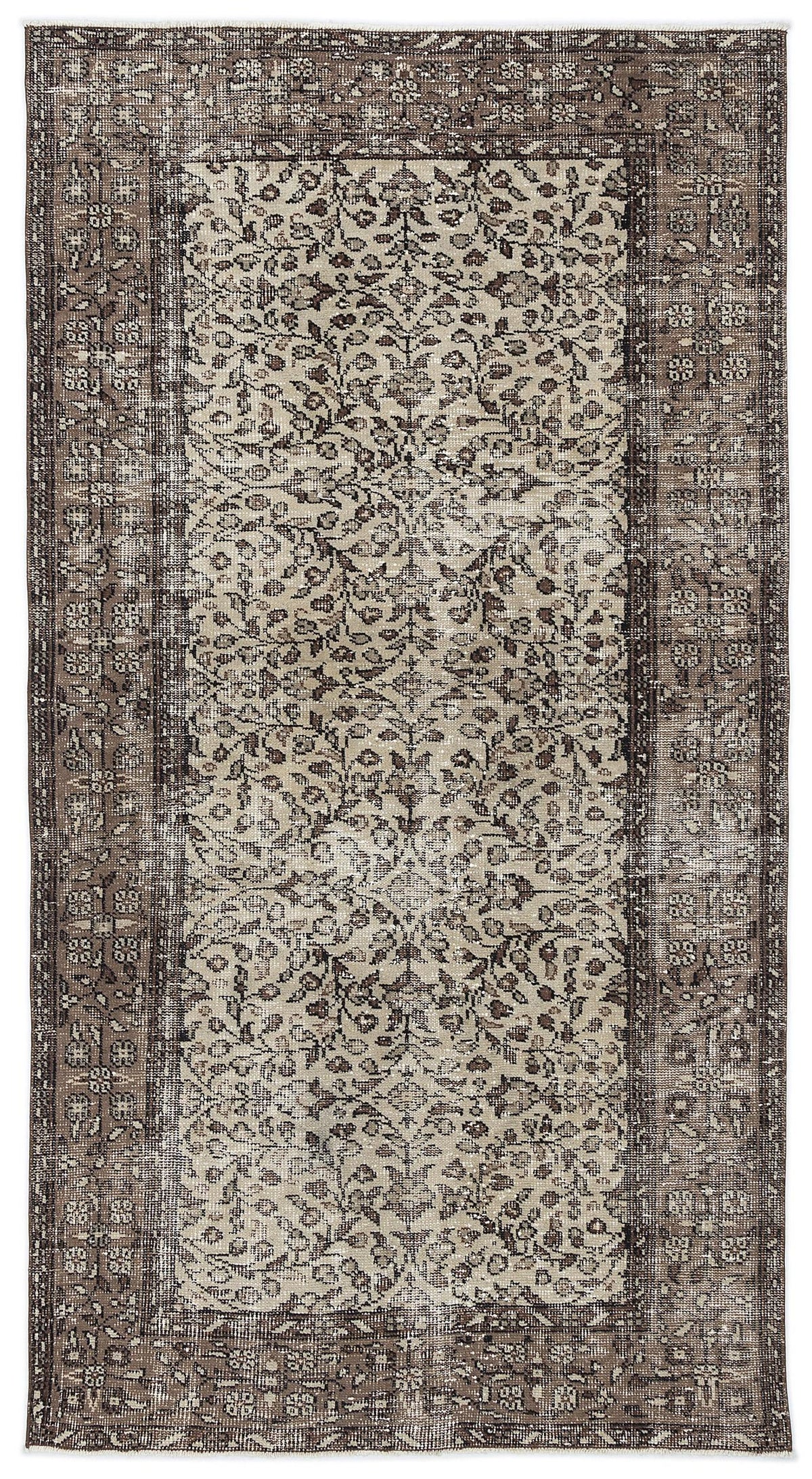 Distressed brown and beige vintage-style rug with a central floral medallion and intricate border pattern.