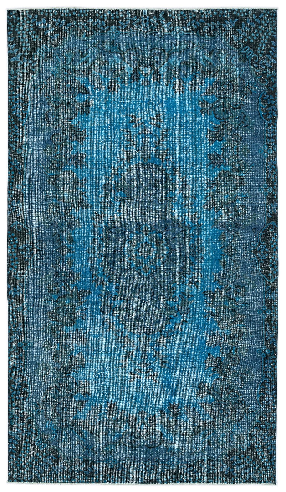 Distressed blue and black vintage-style rug with a central floral medallion and ornate border.