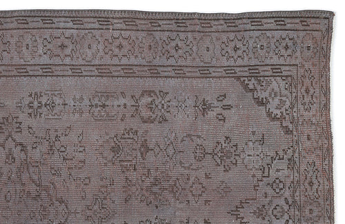 Load image 1 in gallery view. Charcoal grey vintage-style rug with a distressed geometric border and central floral medallion pattern.