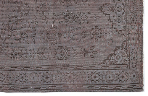 Load image 1 in gallery view. Dark charcoal grey rug with a distressed traditional floral medallion pattern and a geometric border.