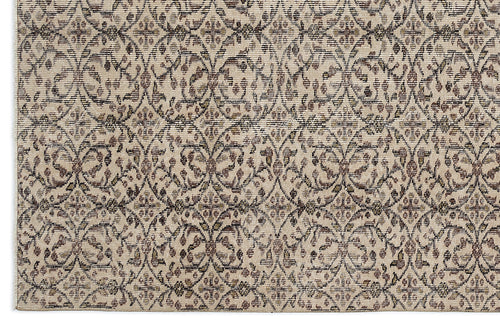 Load image 1 in gallery view. Beige and brown rug with a repeating lattice pattern of stylized floral medallions and distressed textures.