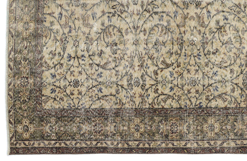 Load image 1 in gallery view. Beige and olive green vintage-style rug with a distressed floral medallion pattern and a dark brown border.