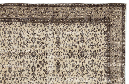 Load image 1 in gallery view. Dark brown and beige vintage-style rug with a traditional floral vine pattern and a decorative border.