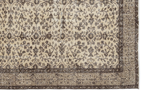 Load image 1 in gallery view. Beige and dark brown traditional rug with a repeating floral vine pattern and a wide decorative border.