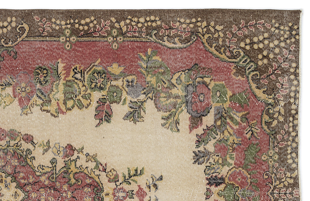 Traditional rug corner with a cream center, red border, and brown outer edge featuring floral and vine motifs.