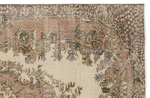 Load image 1 in gallery view. Distressed beige, brown, and sage green rug with a traditional floral medallion pattern on a white background.