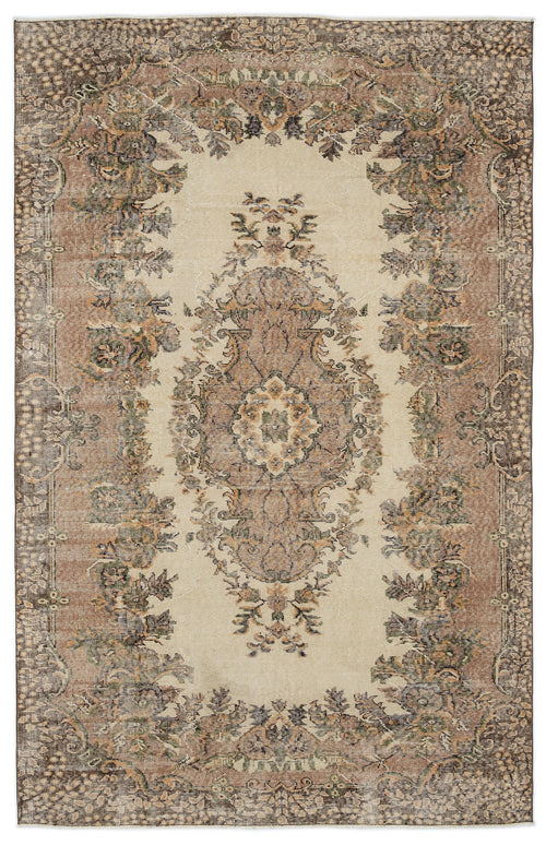 Load image 1 in gallery view. Distressed beige rug with a brown and sage green central floral medallion and ornate border.