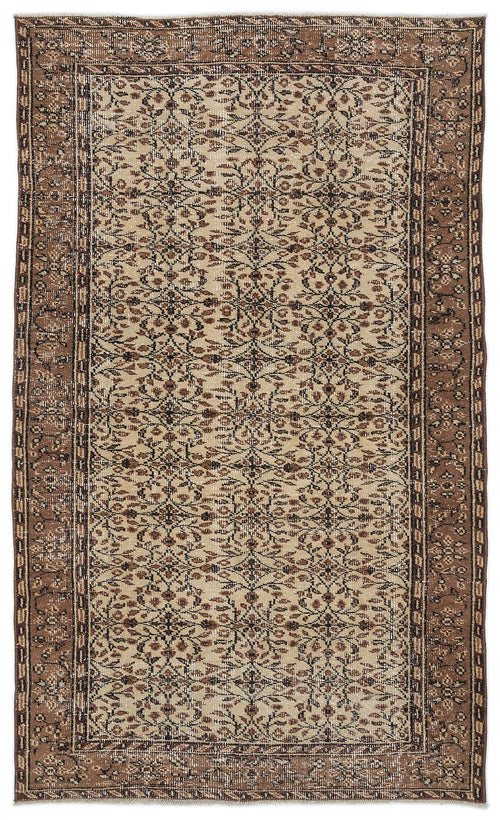 Load image 1 in gallery view. Beige and brown vintage-style rug with a repeating floral vine pattern and a wide, ornate border.
