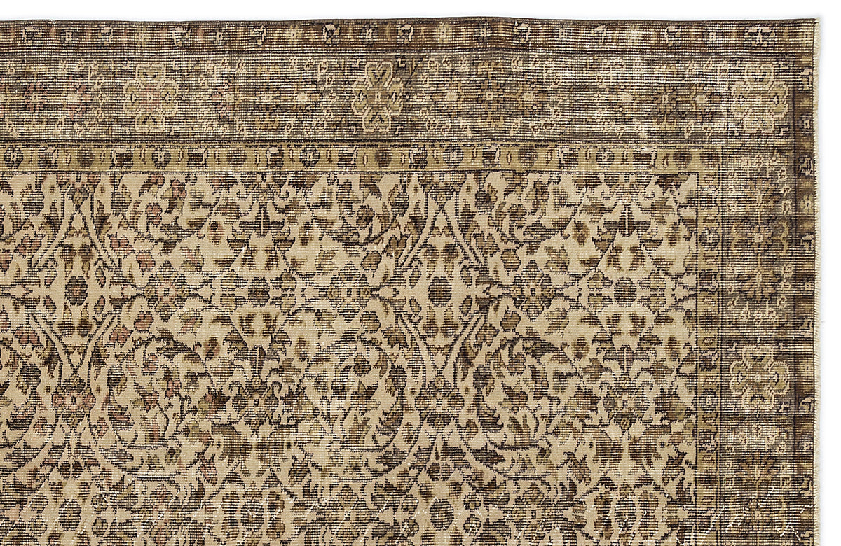 Brown and beige traditional rug with a distressed floral medallion pattern and a detailed border.