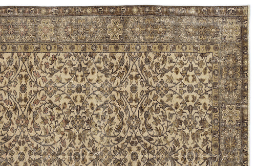 Load image 1 in gallery view. Brown and beige traditional rug with a distressed floral medallion pattern and a detailed border.