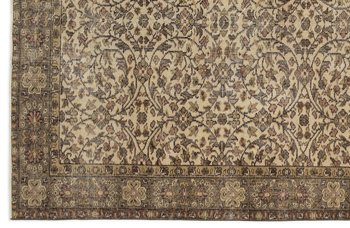 Load image 1 in gallery view. Beige and brown traditional rug with a distressed floral vine pattern and a detailed decorative border.