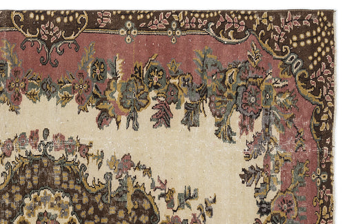 Load image 1 in gallery view. Distressed traditional rug with a floral medallion pattern in muted brown, dusty rose, and cream.