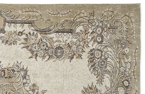 Load image 1 in gallery view. Taupe and cream rug with a distressed traditional floral medallion pattern and ornate border.