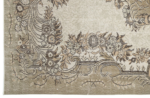 Load image 1 in gallery view. Beige and taupe traditional rug with a distressed floral medallion pattern and intricate border detail.