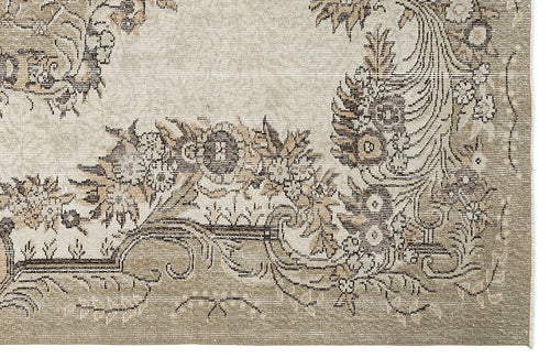 Load image 1 in gallery view. Beige and taupe rug with a distressed traditional floral medallion pattern and ornate border.