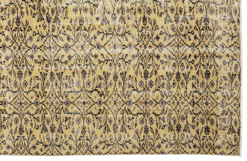 Load image 1 in gallery view. Mustard yellow rug with a distressed, repeating dark brown and grey floral lattice pattern.