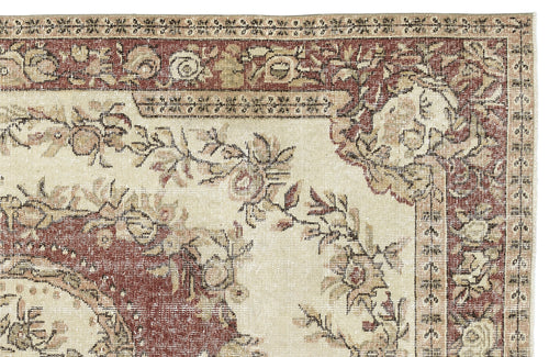 Load image 1 in gallery view. Cream and terracotta traditional rug with a distressed floral medallion pattern and ornate border.