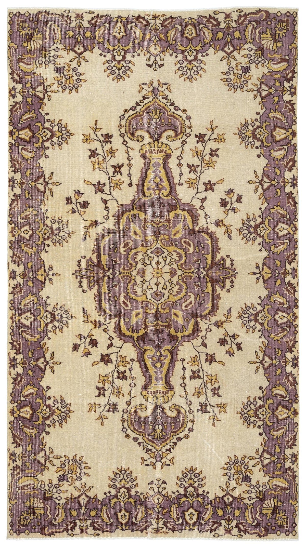 Beige rug with a central purple and gold floral medallion and a matching ornate floral border.
