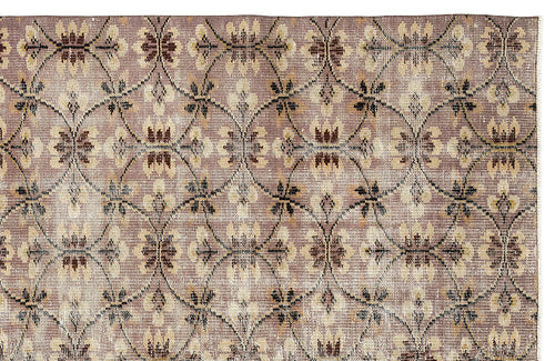 Load image 1 in gallery view. Mauve and beige rug with a repeating dark brown lattice pattern and floral motifs.