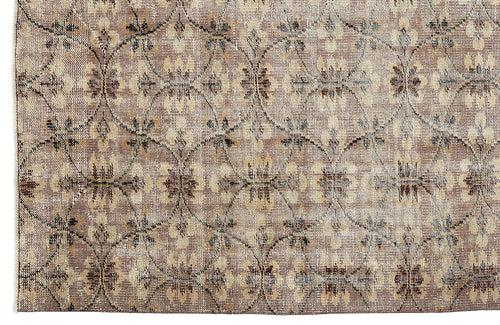 Load image 1 in gallery view. Taupe and beige rug with a distressed trellis pattern featuring repeating floral medallions.