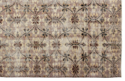 Load image 1 in gallery view. Taupe and beige rug with a repeating dark brown lattice pattern and floral motifs.