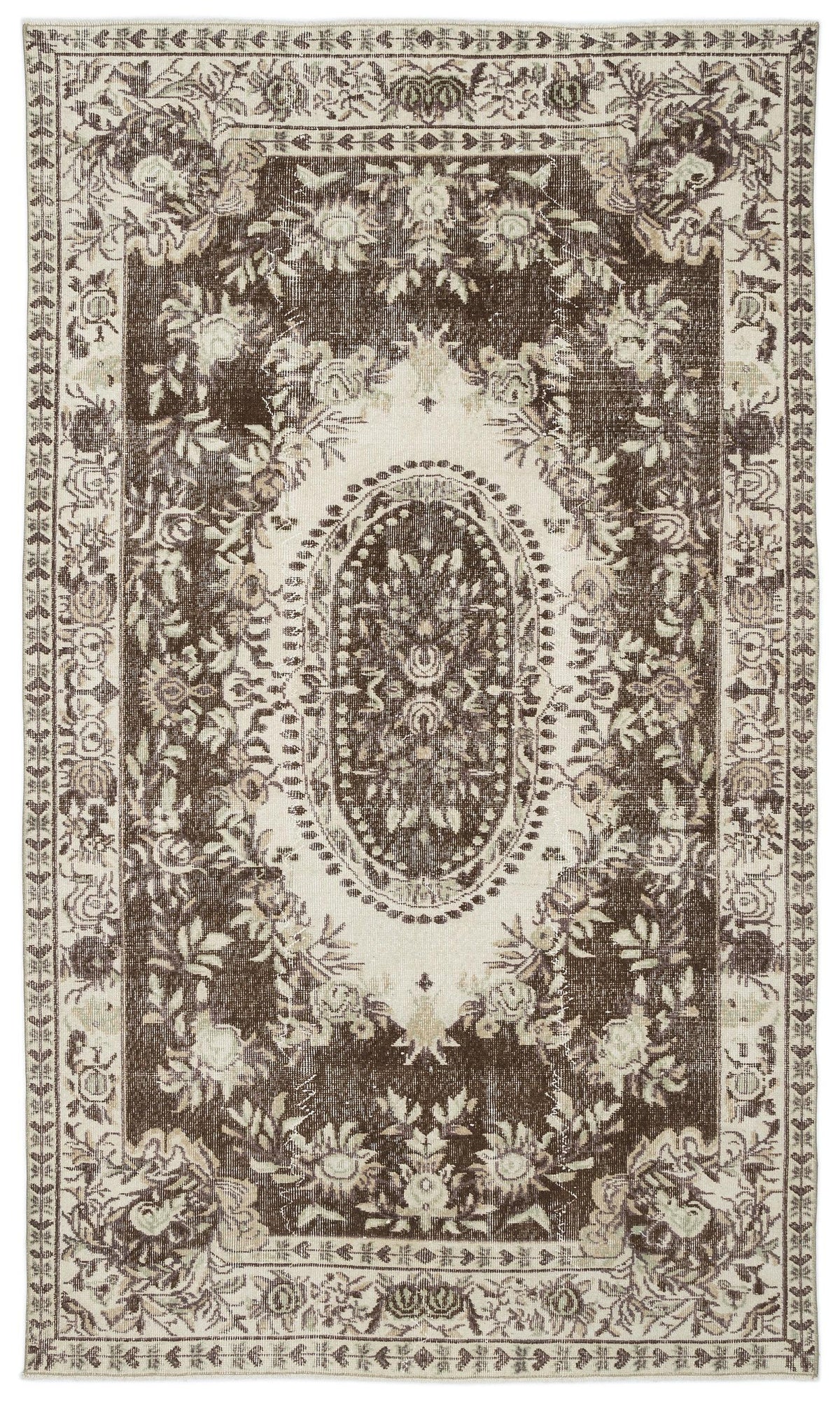 Dark brown and cream vintage-style rug with a central floral medallion and ornate border pattern.