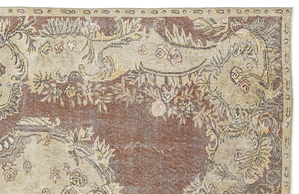 Rust and cream traditional rug with a distressed floral medallion pattern.