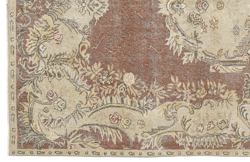 Load image 1 in gallery view. Rust and beige traditional rug with a distressed floral medallion pattern and a detailed border.