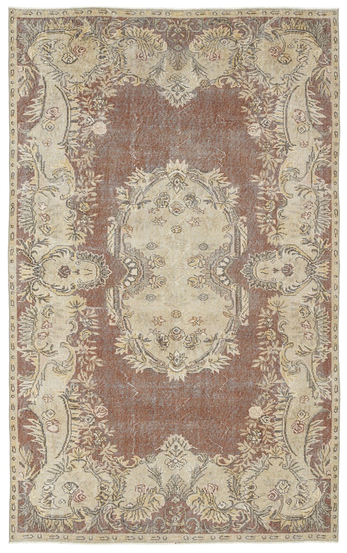 Distressed brown and beige traditional rug with a central floral medallion and ornate botanical border.