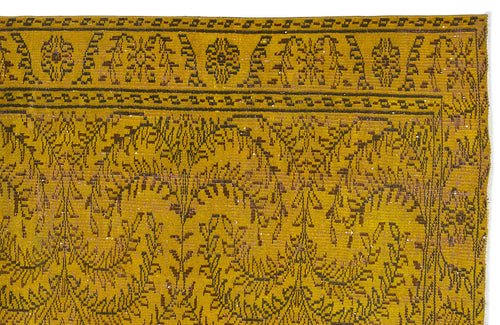 Load image 1 in gallery view. Mustard yellow rug with dark brown floral and geometric border patterns on a white background.